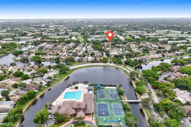 3720 NW 20th St, Coconut Creek, FL 33066 - aerial view of property and surrounding area featuring a pool, a nearby body of water, and nearby suburban area