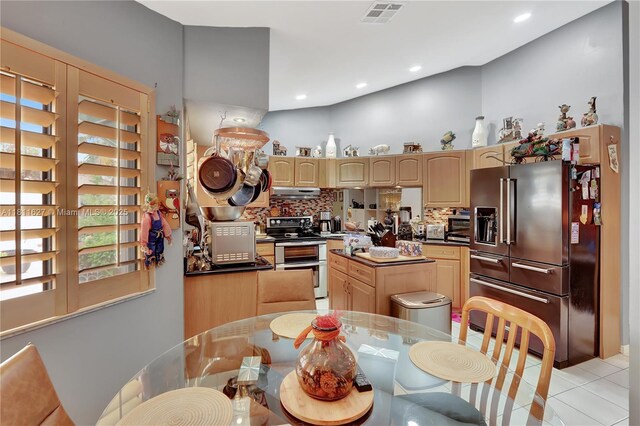 3720 NW 20th St, Coconut Creek, FL 33066 - kitchen with appliances with stainless steel finishes, light brown cabinetry, a center island, under cabinet range hood, and recessed lighting