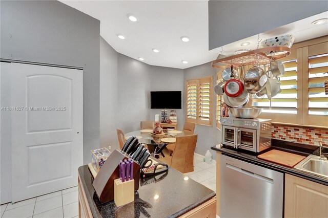 3720 NW 20th St, Coconut Creek, FL 33066 - kitchen with dishwasher, light tile patterned floors, recessed lighting, tasteful backsplash, and a chandelier