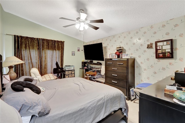 3720 NW 20th St, Coconut Creek, FL 33066 - bedroom with wallpapered walls, lofted ceiling, a textured ceiling, a ceiling fan, and a desk