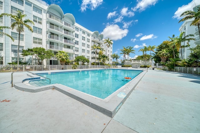 486 NW 165th St Rd Unit B-303, Miami, FL 33169 - community pool featuring a patio area
