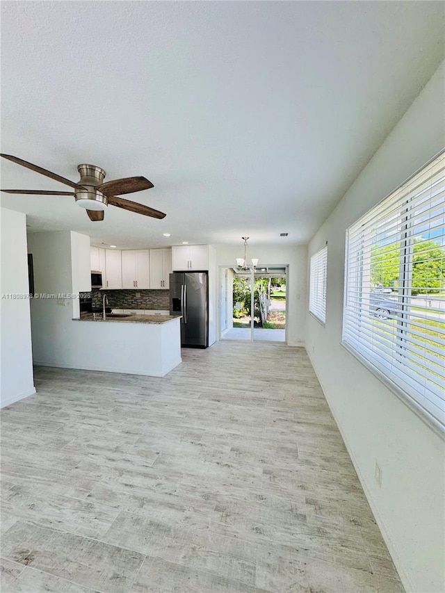 4341 NW 59th St, North Lauderdale, FL 33319 - unfurnished living room featuring a ceiling fan, a chandelier, light wood-style floors, and recessed lighting