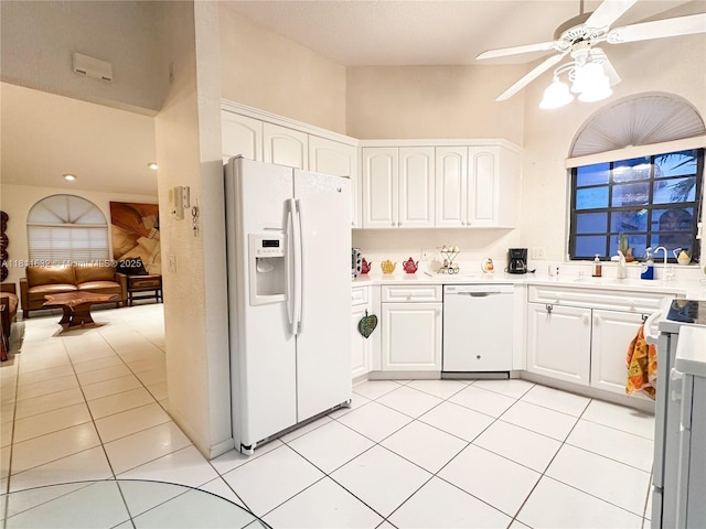 5154 Floria Dr Unit O, Boynton Beach, FL 33437 - kitchen with white appliances, a ceiling fan, white cabinets, light tile patterned flooring, and light countertops