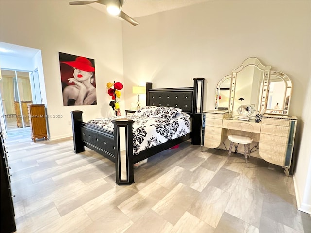 5154 Floria Dr Unit O, Boynton Beach, FL 33437 - bedroom featuring a high ceiling, baseboards, and a ceiling fan