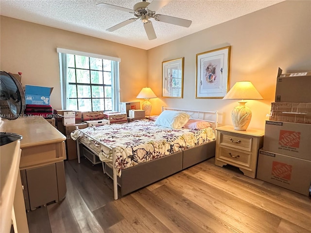 5154 Floria Dr Unit O, Boynton Beach, FL 33437 - bedroom featuring light wood finished floors, a textured ceiling, and a ceiling fan