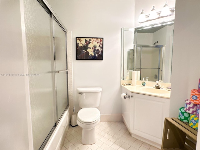 5154 Floria Dr Unit O, Boynton Beach, FL 33437 - bathroom featuring tile patterned floors, vanity, toilet, enclosed tub / shower combo, and baseboards