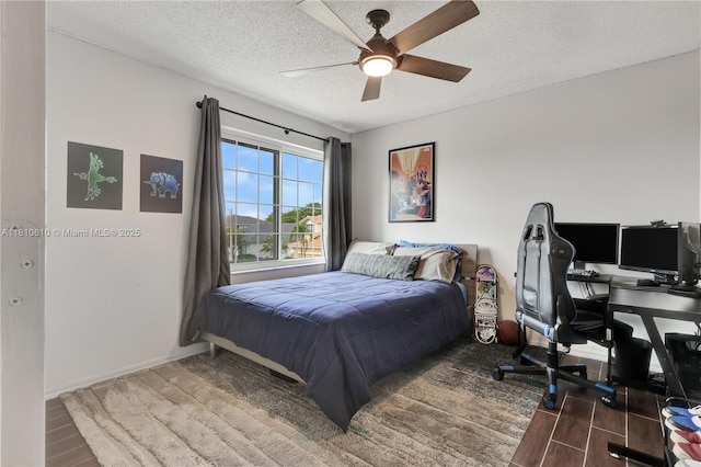 16222 NW 17th Ct, Pembroke Pines, FL 33028 - bedroom with wood finished floors, a textured ceiling, a desk, ceiling fan, and baseboards