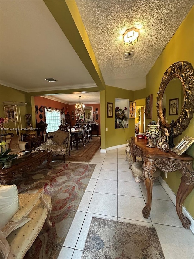 11920 SW 20th St, Miramar, FL 33025 - entryway with a chandelier, light tile patterned flooring, a textured ceiling, baseboards, and ornamental molding
