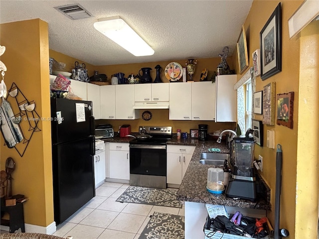 11920 SW 20th St, Miramar, FL 33025 - kitchen featuring freestanding refrigerator, electric range, a sink, under cabinet range hood, and dark countertops