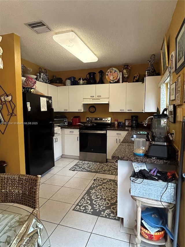 11920 SW 20th St, Miramar, FL 33025 - kitchen with electric range, freestanding refrigerator, under cabinet range hood, a sink, and dark countertops