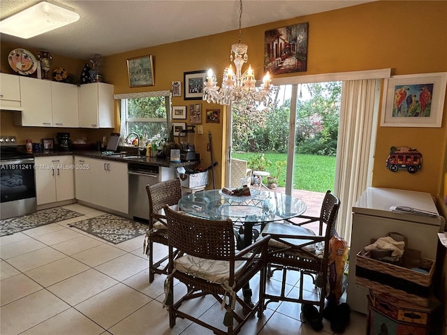 11920 SW 20th St, Miramar, FL 33025 - dining area featuring a chandelier and light tile patterned flooring