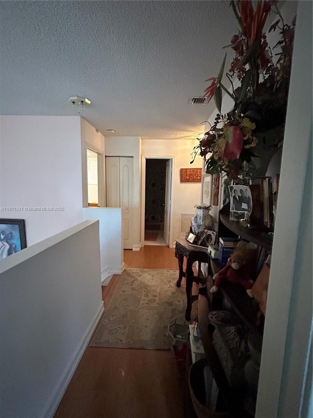11920 SW 20th St, Miramar, FL 33025 - corridor with wood finished floors and a textured ceiling