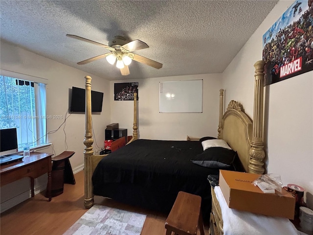 11920 SW 20th St, Miramar, FL 33025 - bedroom featuring wood finished floors, a textured ceiling, and ceiling fan