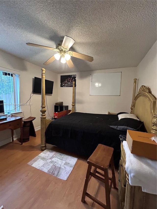 11920 SW 20th St, Miramar, FL 33025 - bedroom with wood finished floors, a textured ceiling, and ceiling fan