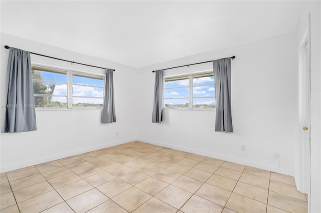 2500 SW 81st Ave Unit 402, Davie, FL 33324 - empty room with plenty of natural light, baseboards, and light tile patterned floors