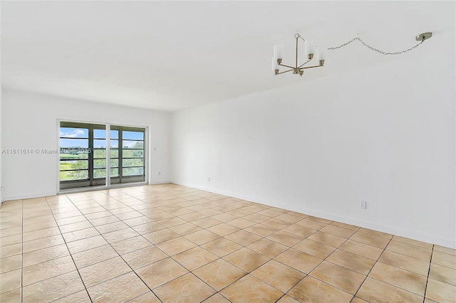 2500 SW 81st Ave Unit 402, Davie, FL 33324 - spare room featuring light tile patterned floors and a chandelier