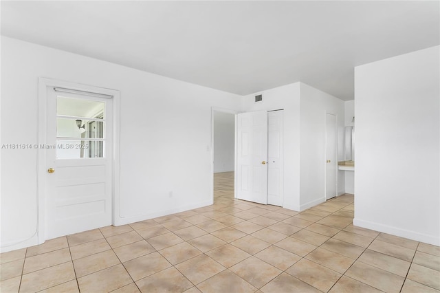 2500 SW 81st Ave Unit 402, Davie, FL 33324 - empty room with light tile patterned flooring and baseboards