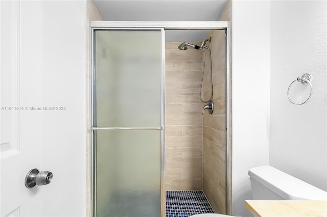 2500 SW 81st Ave Unit 402, Davie, FL 33324 - bathroom featuring a shower stall, toilet, and vanity