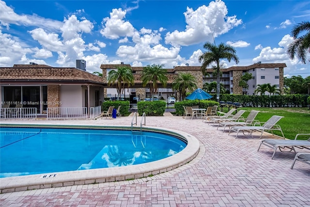 2500 SW 81st Ave Unit 402, Davie, FL 33324 - community pool with a patio and central air condition unit