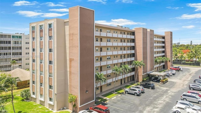 500 NE 12th Ave Unit 407, Hallandale Beach, FL 33009 - view of apartment building / complex featuring uncovered parking