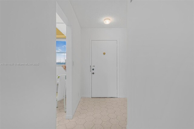 500 NE 12th Ave Unit 407, Hallandale Beach, FL 33009 - hall with a textured ceiling