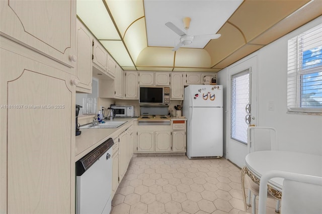 500 NE 12th Ave Unit 407, Hallandale Beach, FL 33009 - kitchen with white appliances, light countertops, ceiling fan, and a sink