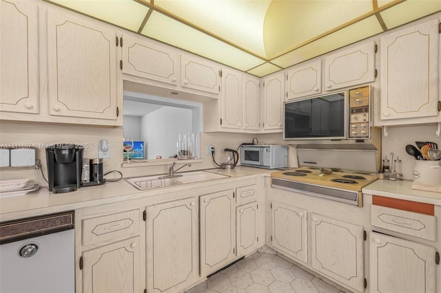 500 NE 12th Ave Unit 407, Hallandale Beach, FL 33009 - kitchen with white appliances, a sink, light countertops, and light tile patterned floors