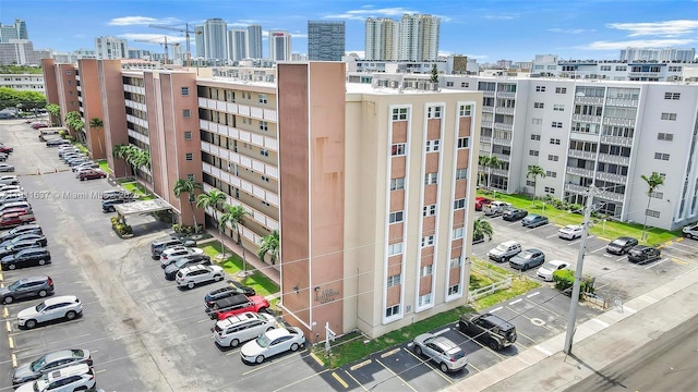 500 NE 12th Ave Unit 407, Hallandale Beach, FL 33009 - view of property with uncovered parking and a skyline view