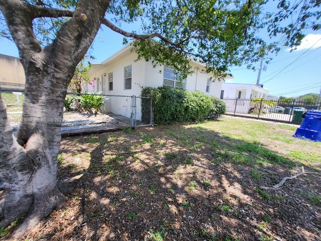 640-642 NW 77th St, Miami, FL 33150 - view of yard featuring a gate
