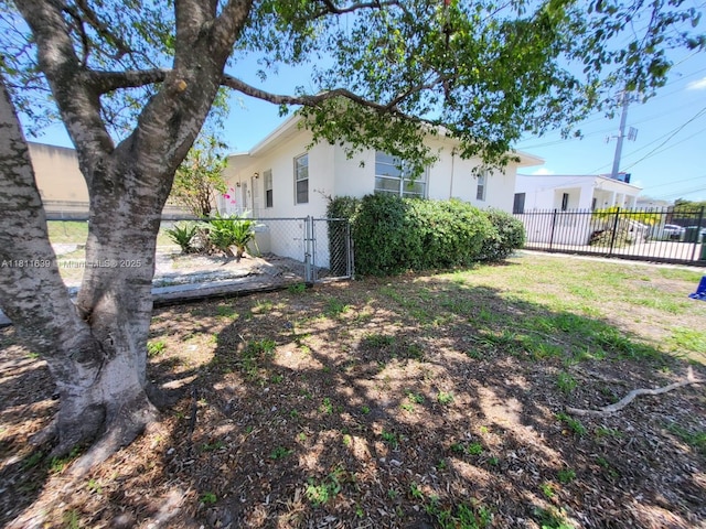 640-642 NW 77th St, Miami, FL 33150 - fenced yard featuring a gate