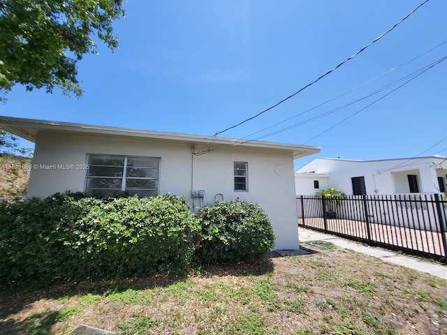 640-642 NW 77th St, Miami, FL 33150 - view of side of home featuring stucco siding