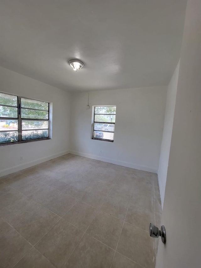 640-642 NW 77th St, Miami, FL 33150 - unfurnished room featuring light tile patterned flooring and baseboards