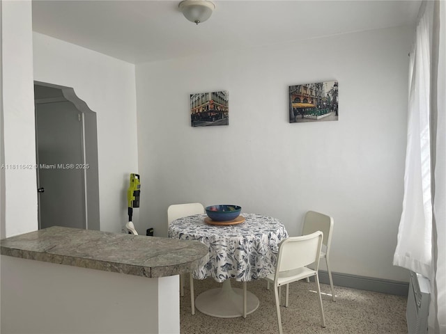 865 80th St, Miami Beach, FL 33141 - dining space featuring speckled floor and baseboards
