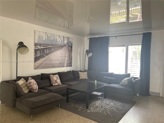 865 80th St, Miami Beach, FL 33141 - living room with speckled floor, a high ceiling, and plenty of natural light