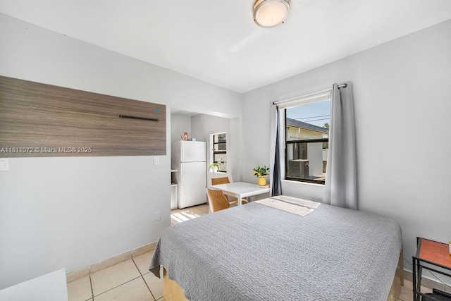 8320 SW 43rd Ter, Miami, FL 33155 - bedroom with freestanding refrigerator and light tile patterned flooring