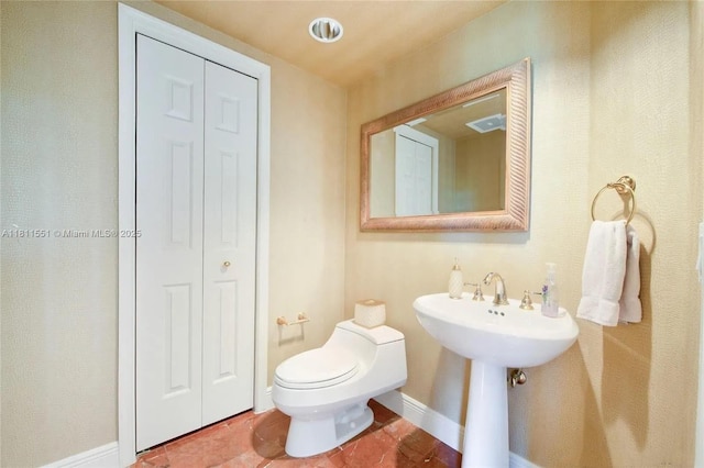 13627 Deering Bay Dr Unit 402, Coral Gables, FL 33158 - half bath with toilet, baseboards, a closet, and tile patterned floors
