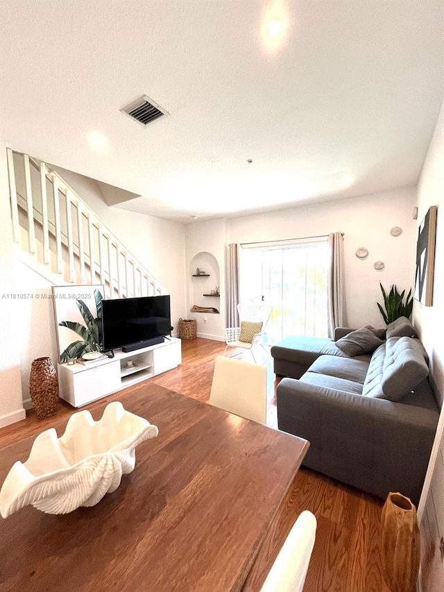 5670 NW 116th Ave Unit 212, Doral, FL 33178 - living area featuring wood finished floors, stairway, baseboards, and recessed lighting