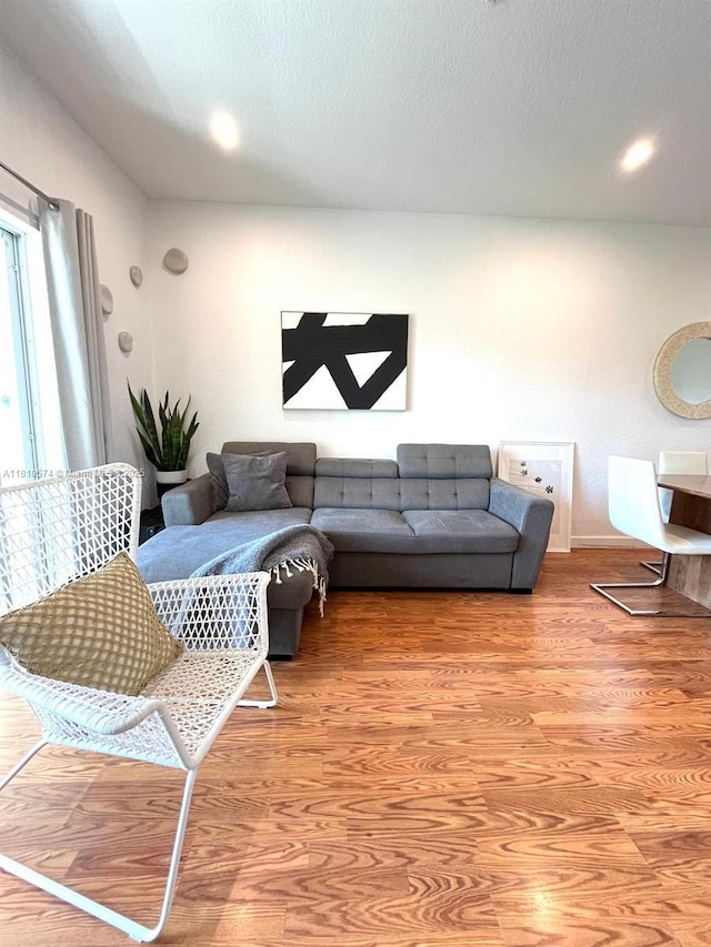 5670 NW 116th Ave Unit 212, Doral, FL 33178 - living room featuring light wood-style floors and baseboards