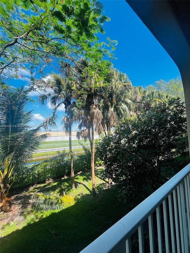 5670 NW 116th Ave Unit 212, Doral, FL 33178 - view of grassy yard featuring a balcony