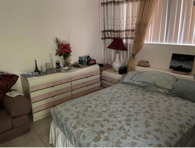 1570 NE 130th St, North Miami, FL 33161 - bedroom featuring light tile patterned floors