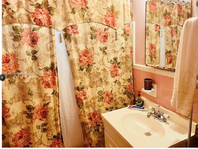 1570 NE 130th St, North Miami, FL 33161 - bathroom with tile walls and vanity