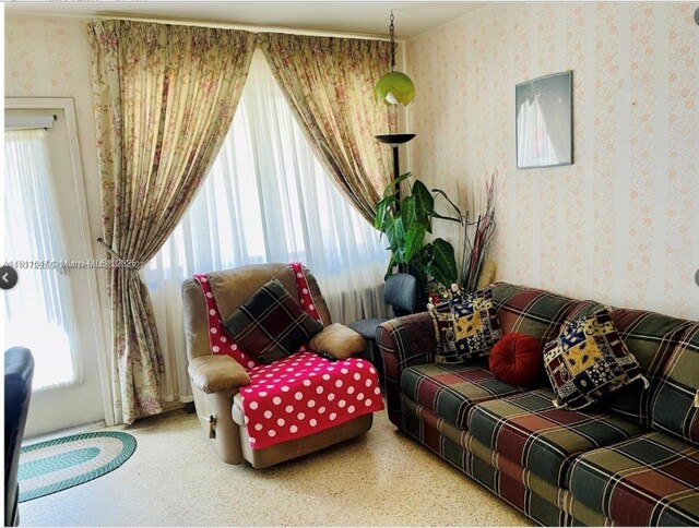 1570 NE 130th St, North Miami, FL 33161 - living room featuring wallpapered walls