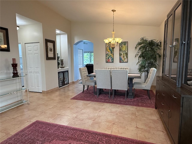16306 SW 11th St, Pembroke Pines, FL 33027 - dining space with arched walkways, a chandelier, baseboards, and light tile patterned floors