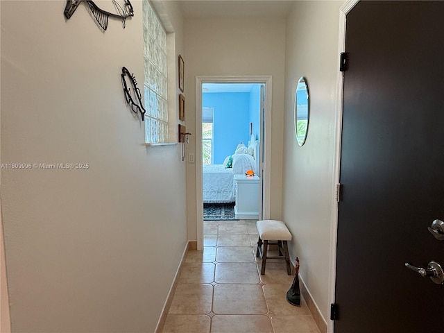 16306 SW 11th St, Pembroke Pines, FL 33027 - corridor featuring baseboards and light tile patterned floors