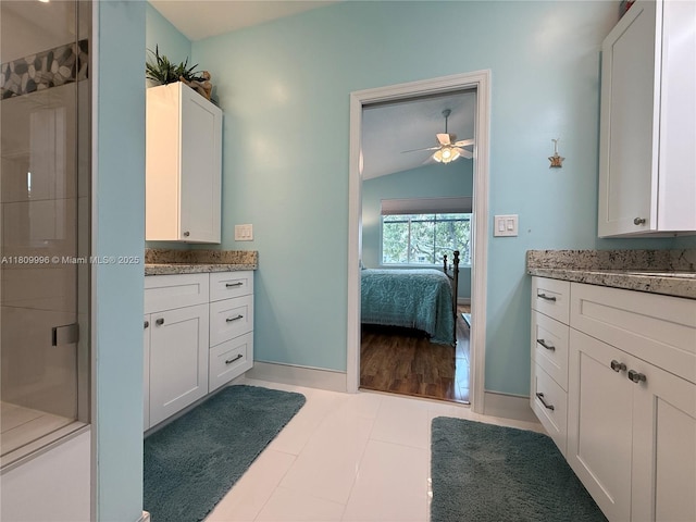 16306 SW 11th St, Pembroke Pines, FL 33027 - ensuite bathroom with vaulted ceiling, vanity, a shower stall, ceiling fan, and baseboards