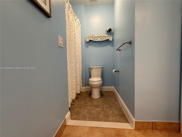 16306 SW 11th St, Pembroke Pines, FL 33027 - bathroom featuring toilet, tile patterned floors, baseboards, and curtained shower
