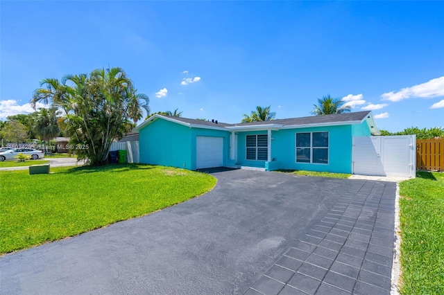 12351 NW 29th Mnr, Sunrise, FL 33323 - ranch-style home featuring a garage, driveway, and stucco siding