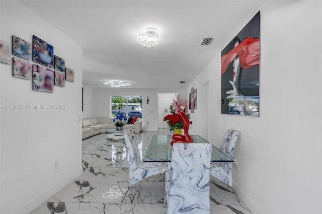 12351 NW 29th Mnr, Sunrise, FL 33323 - dining space with baseboards and marble finish floors