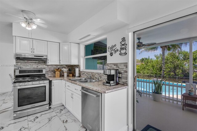 12351 NW 29th Mnr, Sunrise, FL 33323 - kitchen with stainless steel appliances, a sink, a ceiling fan, and under cabinet range hood