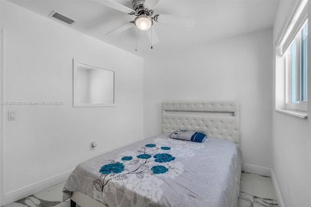 12351 NW 29th Mnr, Sunrise, FL 33323 - bedroom with marble look tile flooring, baseboards, and a ceiling fan